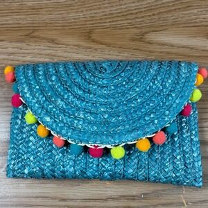 Chantecaille Turquoise Woven Straw Clutch With Pom Pom Trim